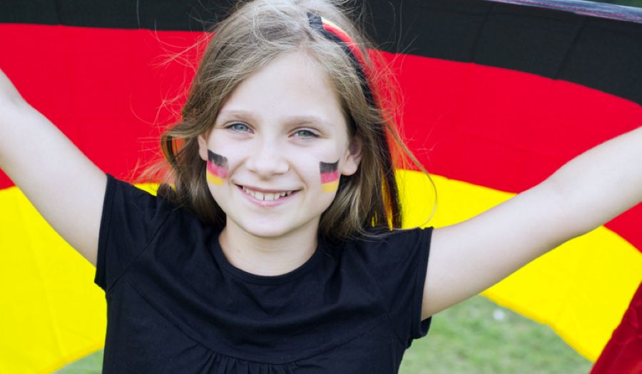 Child holding a German flag, representing Germany in a family law context