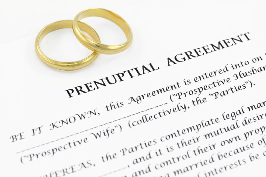 Couple seated together discussing a prenuptial agreement before marriage