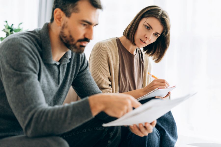 financial remedy divorce UK couple reviewing financial documents together