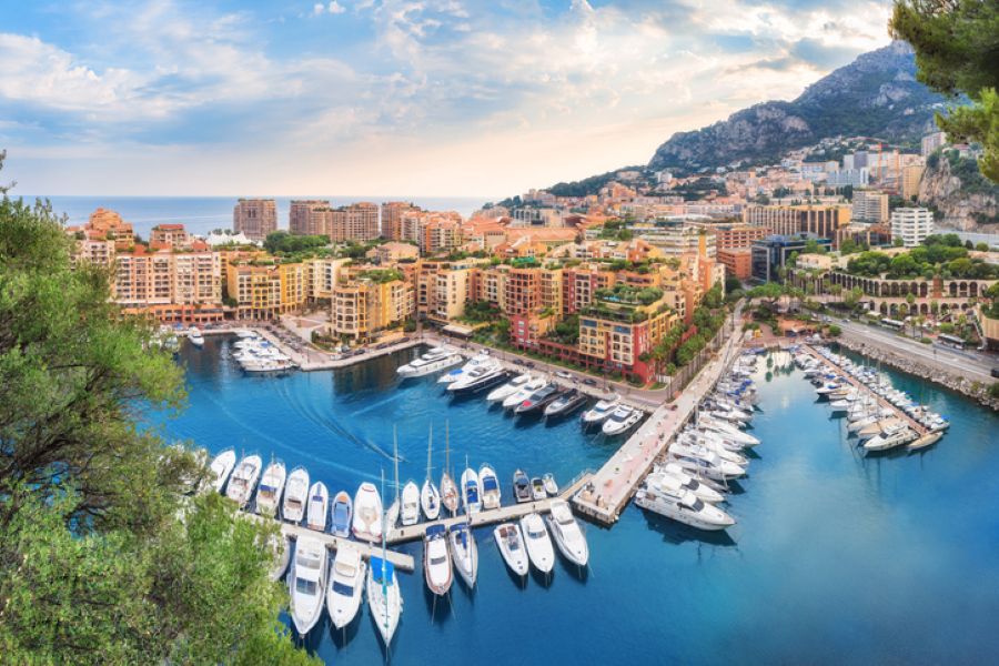 Luxury marina and international wealth lifestyle associated with offshore financial jurisdictions and high-net-worth family structures