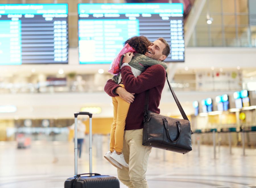 International family embracing at the airport — the reality behind every international divorce jurisdiction case